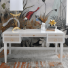 Contrasting natural grasscloth drawers add an organic feel to this timeless, matte white lacquer frame.