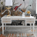 Contrasting natural grasscloth drawers add an organic feel to this timeless, matte white lacquer frame.