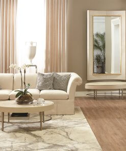 Curved white hair on hide floor mirror lifestyle.