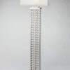 Linked Tower Floor Lamp features intricate linking. Silver
