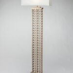 Linked Tower Floor Lamp features intricate linking. Champagne color