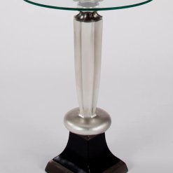 Silver pedestal side table with glass top.