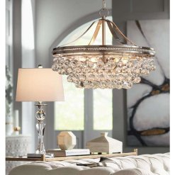 A shimmering five-light pendant chandelier with an array of clear crystal accents and a brushed nickel frame.