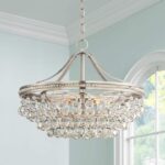 Chandelier with round droplets all around dangling from a brushed nickel round frame.