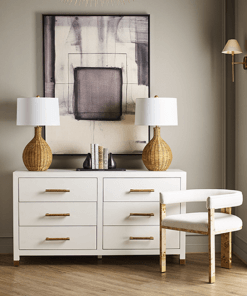 Tailored in crisp white linen upholstery, tri-leg frame, burl wood in light finish and brass ferrule hardware.