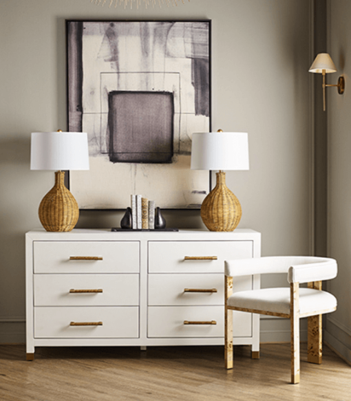 Tailored in crisp white linen upholstery, tri-leg frame, burl wood in light finish and brass ferrule hardware.