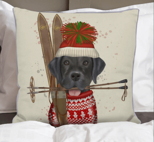 Black Lab is sporting his tasseled Tuke and red ski sweater front view.