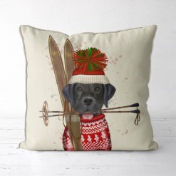 Holiday/Winter pillow featuring a black lab with a tasseled hat and a pair of skis.