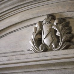 Acanthus Shield on headboard closeup