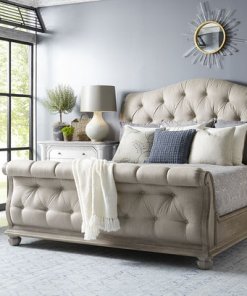 Cottage Tufted Sleigh Bed in a blue room