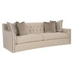 This upholstered sofa shown in woven sand color fabric.