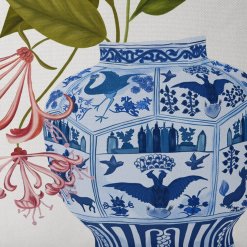 Pillow with Chinchona Vase w red flower design, closeup view.
