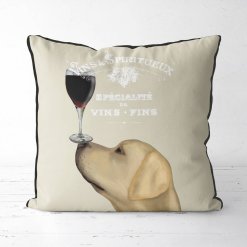 Yellow Lab with a glass of red wine balanced on his nose.