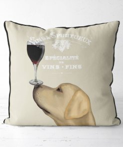 Yellow Lab with a glass of red wine balanced on his nose.