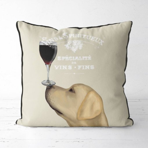 Yellow Lab with a glass of red wine balanced on his nose.