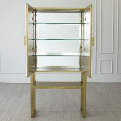 Gypsum bar cabinet with front doors open.