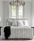 Soft white Silhouette upholstered channeled bed.