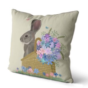Pillow with a grey bunny sitting in a basket with pink and blue flowers. Side view.