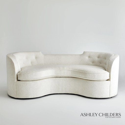 Lauren sofa, front view. A curvaceous shape, bench seat cushion, and button-tufted detail on inside back.