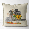 Pillow featuring a raccoon family in a cart with lots of sunflowers.