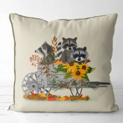 Pillow featuring a raccoon family in a cart with lots of sunflowers.