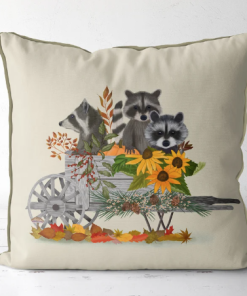 Pillow featuring a raccoon family in a cart with lots of sunflowers.