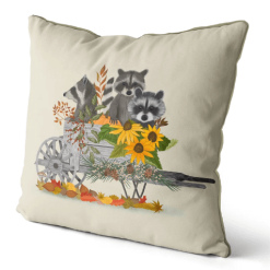 Pillow featuring a raccoon family in a cart with lots of sunflowers.