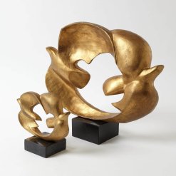2 doves connected by their wings that forms a circle. Gold leaf finish sits on black granite base.