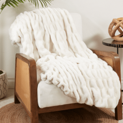 Ivory ruched throw on lounge chair