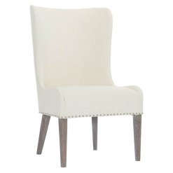 Albion upholstered wingback chair, with exposed legs.