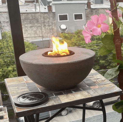 City bonfire product patio, with lit fire.