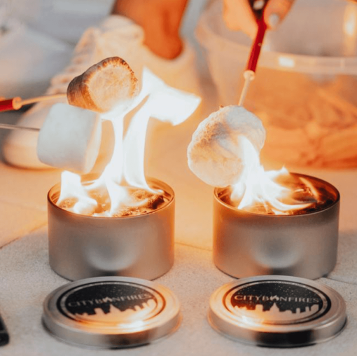 2 portable fire pits shown lit