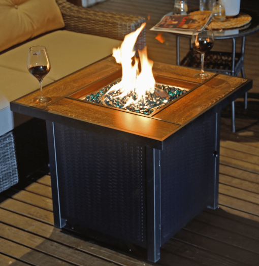 30" Gas Fire pit with table top at night lifestyle.