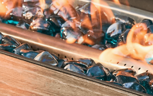 42" Gas Fire pit blue fire glass closeup.