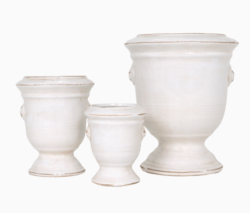 Tuscan planters stacked side by side in a row backside