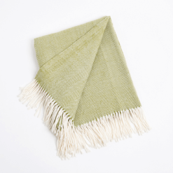 Herringbone throw in grass green color, open.