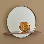 Round mirror walnut shelf with glass vase