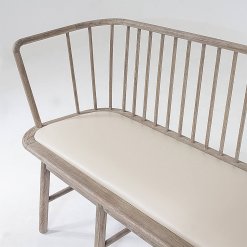 Spindle bench with beige leather seat