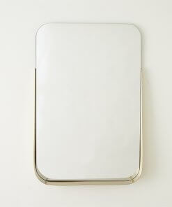 Rectangular mirror with brushed brass shelf front view.