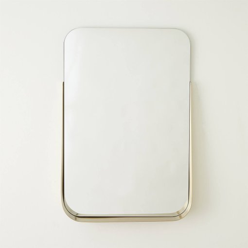 Rectangular mirror with brushed brass shelf front view.