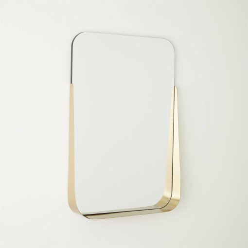 Rectangular mirror with brushed brass shelf angled.