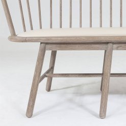 Spindle bench with beige leather frame