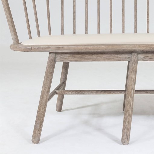 Spindle bench with beige leather frame